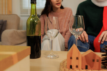 Lovers toasting with wine, enjoying a warm Christmas Eve together.