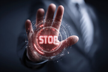 Businessperson hand showing stop gesture with digital warning hologram
