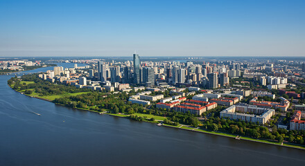 Aerial view of a sprawling city skyline with a wide river