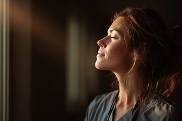Woman enjoying a quiet moment by the window