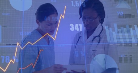 Nurse lifting medical tablet and doctor pointing while reviewing patient data with charts rising - Powered by Adobe