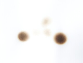 Black burn marks on aged paper with vintage stain details. Paper burned with black marks. Old fire...