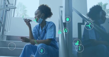 Female nurse on stairs speaking into smartphone and generating icons visualizing health tech data - Powered by Adobe