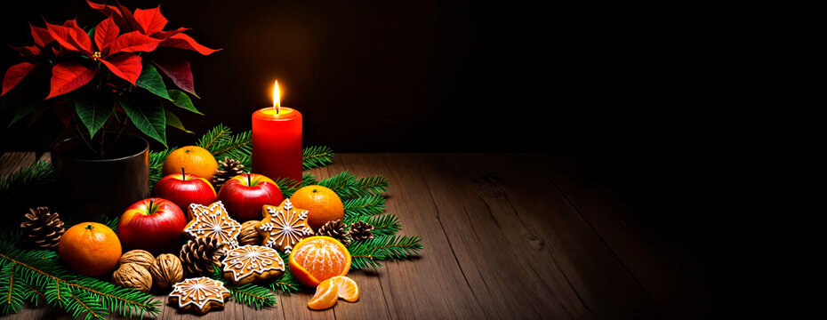 Christmas Still Life Composition  with Red Poinsettia Plant, Traditional Decorations  and Burning Candle in Dark 