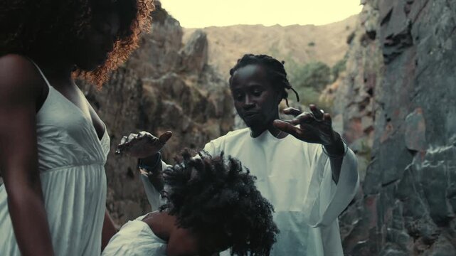 Baptism pool ritual in traditional dress celebrated at scenic location