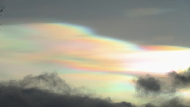 Rare nacreous clouds glow and ripple at sunrise. Pearlescent sheets flowing across the cold stratosphere