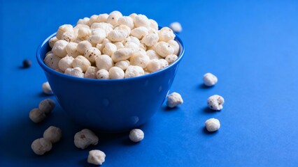Healthy Roasted Makhana Snacks in Vibrant Colored Bowls Against Matching Backgrounds; Indian Superfood Fox Nuts