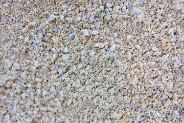 Fine sand texture with small stones, natural background