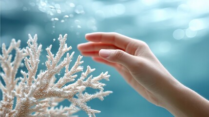 Human hand reaching toward a dying coral, delicate contact, concept of fragile balance and responsibility
