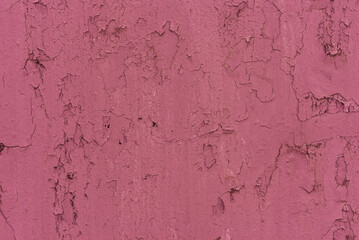 A solid colored background with a distinct, uneven texture