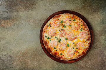 four cheese pizza with shrimp and fresh microgreens, served on a wooden board, homemade, no people,