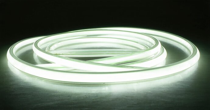 Bright neon circles overlap, creating soft glow. Minimalist studio shot with dark background, highlighting light source.
