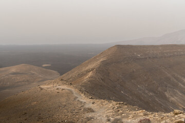 hiking in the volcano landscape of Timanfaya in Lanzarote