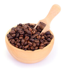 Roasted coffee beans in wooden bowl with scoop isolated on white background