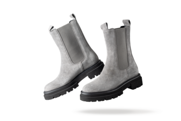 Trendy fashionable grey suede leather short women pair chelsea boots isolated on white background. Casual style.