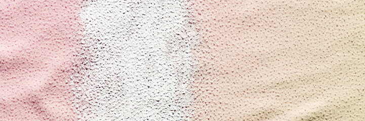 Abstract textured surface with vertical lines and speckled patterns in soft red, white, and beige tones.