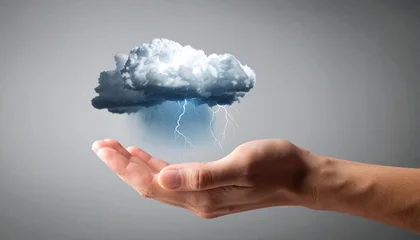 Hand holding a storm cloud with lightning © Ozgurluk Design