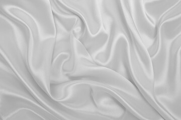 Smooth elegant white silk or satin luxury cloth texture as wedding background. Luxurious background design