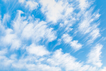 Blue sky and white clouds background  Strange clouds cover a blue sky in the background