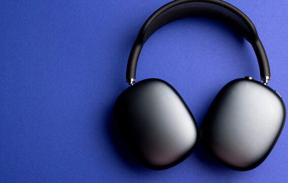 Bialystok, Poland -22.10.25. Apple AirPods Max on blue background