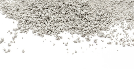 Natural cat litter on a white background. The fine, soft granules are ideal for keeping your home clean and providing comfort for your pets.