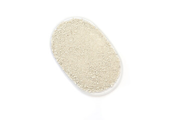 Transparent container holds fine white small granules of cat litter, emphasizing a clean aesthetic and functional design, suitable for storage and organization in various settings View from above