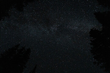 The cosmic canvas displays a celestial wonder in a dark night scene.