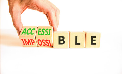 Accessible or impossible symbol. Concept words Accessible or Impossible on beautiful wooden blocks....