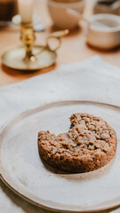 A cookie is on a white plate