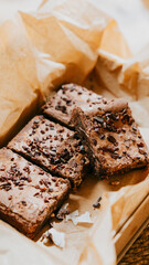 A box of brownies with chocolate chips on top