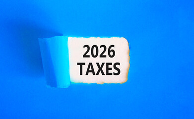 2026 taxes new year symbol. Concept words 2026 taxes on beautiful white paper. Beautiful blue paper background. Business and 2026 taxes new year concept. Copy space.