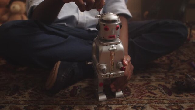 Boy enjoys imaginative playtime with toy robot in a cozy playroom