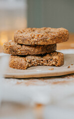 A stack of cookies with one already eaten