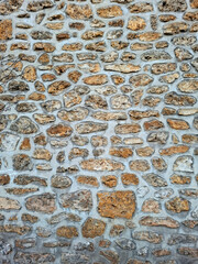 Natural sandstone wall texture showcasing rustic design in outdoor setting