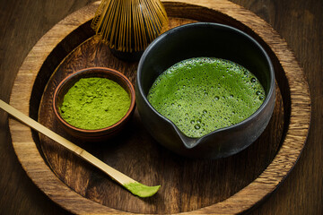 Matcha Tea Ceremony. A traditional matcha tea setup with whisk, bowl, and green tea powder