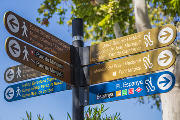 Street signs marking the direction to the few famous sites to visit in Barcelona, Spain