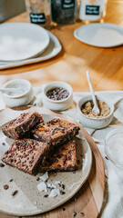 A plate of brownies with chocolate chips on top