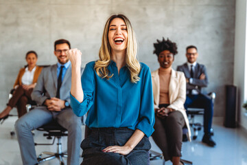 Joyful, excited diverse entrepreneurs are celebrating their success and the great work environment