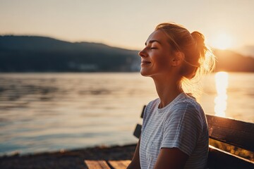 Sunset reflection of a woman enjoying tranquility by the lakeside on a warm evening