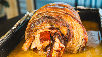 Juicy stuffed beef ribs with calabrese sausage, bacon and vegetables. Golden brown and perfectly cooked, tied with twine. Ideal for gourmet menus and meat promotions.