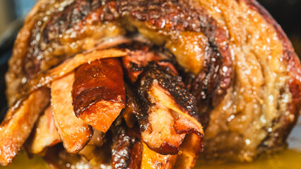 Juicy stuffed beef ribs with calabrese sausage, bacon and vegetables. Golden brown and perfectly cooked, tied with twine. Ideal for gourmet menus and meat promotions.