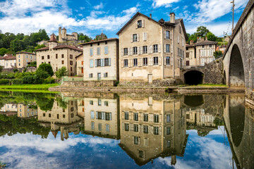 Naklejka premium Laroquebrou typical village and la Cère river, Cantal, France, is an important passage, the via Arverna, for pilgrims on their way to Santiago de Compostela via Rocamadour.