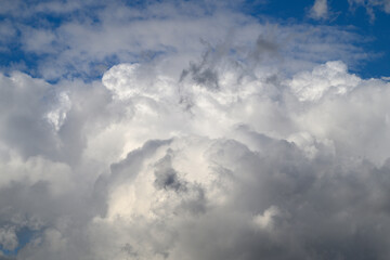 A Dramatic and Striking Cloud Formation Alongside a Bright Blue Sky Positioned Over Us