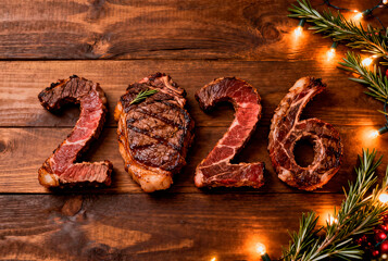  Juicy steaks in the shape of numbers 2026 on a rustic wooden background with warm lighting and an empty space for text are festive culinary decorations for New Year's menus