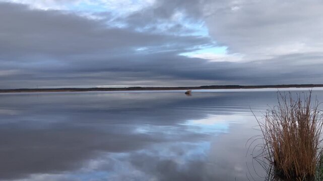 the heavenly cloudy landscape is reflected