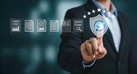 Closeup of a businessmans hand touching a digital shield icon with a refresh symbol, representing data security, protection and system updates