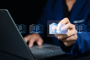 E-library and E-learning Concept, Person using laptop with virtual E-Book icons for online...