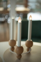 Candles on the table. Electric candles in the interior.