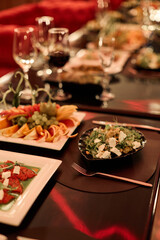Elegant banquet table setting with salads and glassware
