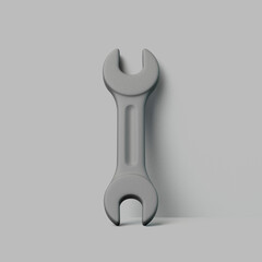 Vertical Steel Wrench Standing on Gray Surface